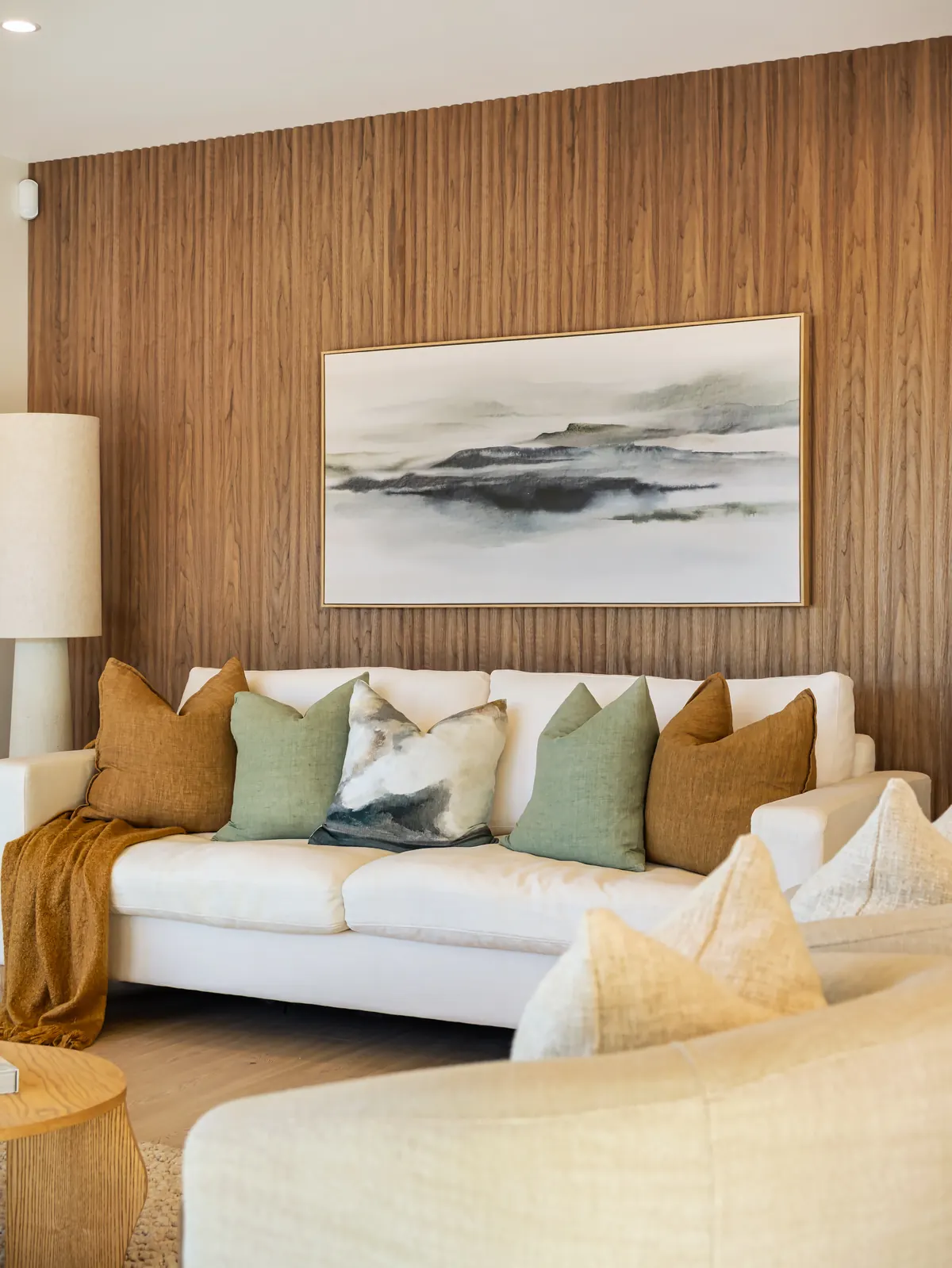 Living room in a Navigation Homes show home with a timber feature wall
